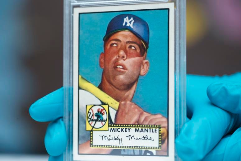 The "Holy Grail" of baseball cards, a 1952 Topps Mickey Mantle that is valued at more than $10 million The "Holy Grail" of baseball cards, a 1952 Topps Mickey Mantle that is valued at more than $10 million